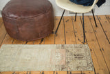 Subtle abrashes with faded ivory, light sea foam green tones on vintage Oushak rug.