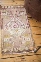 Vintage Oushak rug's brown lower border with stylized shapes and secured fringe.