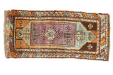 Hand-knotted vintage Oushak runner with unique violet eggplant medallion on faded ocean blue.