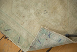 Vintage Oushak rug reverse showing tight hand-knotted weave and original side cord selvedges.