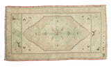 Vintage Oushak rug mat, beige field with subtle mint green medallion and floral spandrels.