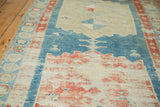 Heavily distressed hand-knotted antique Northwest Persian runner, aqua blue field, coral pinwheel design.