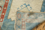 Folded corner of antique Persian runner, revealing its hand-knotted foundation and secured edge.