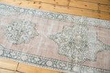 Vintage Oushak runner medallion and border in aqua, ivory, distressed blush.