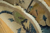 Vintage Chinese pictorial rug's hand-knotted back, secured edge, and colorful village scene.