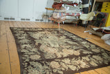Vintage Bessarabian carpet with charcoal brown field and light ivory floral design.