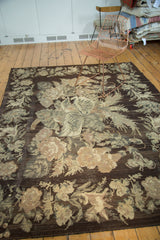Bessarabian carpet detail: large floral arrangement, charcoal field, ivory, beige, sage colors.