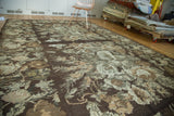 Vintage Kilim Carpet close-up with European stylized rose and leaf pattern in earthen tones.