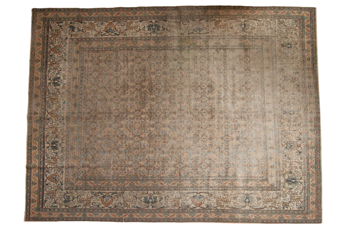 Antique Distressed Khorassan carpet, allover faded rust, blue, and ivory intricate pattern.