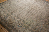 Heavily distressed pattern with exposed foundation, faded rust and blue details on antique Khorassan rug.