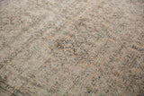 Distressed Khorassan carpet texture, revealing exposed foundation with faded blue and rust.