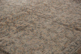 Exposed foundation and textured faded patterns on antique distressed Khorassan rug.
