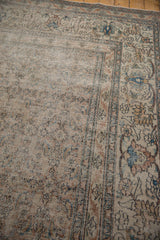 Worn texture and intricate faded patterns on this antique distressed Khorassan carpet.