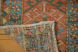 Hand-knotted construction of antique Heriz runner, with brick red, sky blue, celadon green geometric patterns.