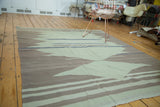 Vintage Kilim detail showing abstract sea foam green, natural grey, and blue patterns.