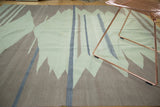 Modern abstract Turkish Kilim rug showcasing soft sea foam green, natural grey, and sky blue motifs.