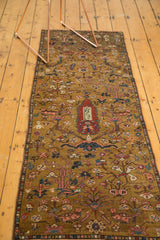 Karabagh runner's central cyprus tree motif, weaver insignia, madder red, gold hues.