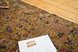 Curvilinear floral motifs in dark gold, blush pink, and teal on antique Karabagh pile.