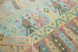 Geometric flatweave kilim paneling with winding river and tree motifs in sky blue, saffron.