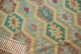 Geometric banded medallions with powder blue, cranberry, saffron, and mallard green.