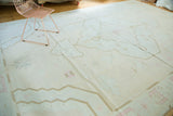 Vintage Dhurrie carpet with simplistic Serapi-inspired pattern in pale peach, teal, and brown.