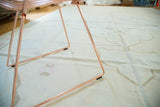 Hand-woven vintage Dhurrie carpet featuring ivory, peach, and coffee geometric Serapi outlines.