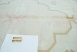 Vintage Dhurrie carpet, pale peach and brown geometric Serapi motifs on ivory. Light staining.