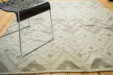 Hand-woven flatweave texture of the abstract ivory and grey geometric Kilim.