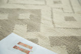 Hand woven Kilim texture with abstract ivory and grey geometric stripe design.