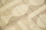 Modern hand woven Kilim rug detail with ivory, beige, grey stripes and diamond pattern.