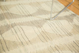 Hand woven Kilim rug texture with ivory, beige, grey alternating stripe and diamond pattern.