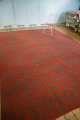 Hand woven modern kilim's repeating endless knot motif in black cherry red and dark charcoal.