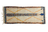 Plush ivory Moroccan runner rug with saffron yellow lattice diamonds and colorful speckled borders.
