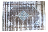 Antique Distressed Sivas carpet with herati medallion, charcoal, sky blue, and exposed white foundation.