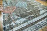 Antique Sivas carpet's distressed texture revealing charcoal herati motifs and exposed foundation.