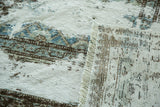 Distressed antique Sivas rug texture, exposed foundation, with pale silver, blue, charcoal, and fringe.