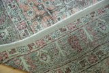 Vintage Tabriz carpet detail: distressed blush red pile with exposed foundation.