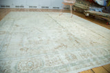 Vintage Sparta carpet's distressed texture and faded allover palmette pattern in muted tones.