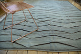 Modern hand woven Kilim rug with grey, silver, and dark charcoal bowed mountain design.