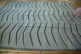 Modern hand woven Afghan Kilim, featuring repetitive bowed mountain design in grey and charcoal.