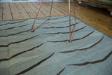 New Afghan Kilim's modern bowed mountain design in grey and dark charcoal.