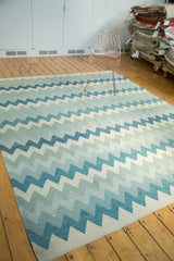 New Egyptian Kilim carpet displaying repeating zigzag motif in blue, ivory, grey.