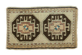 Vintage Oushak rug mat with charcoal brown crab and star medallions, ivory, copper, blue tones.