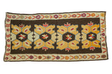 Bold vintage Distressed Kilim runner with yellow, ivory, and dark brown geometric medallions.
