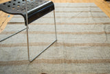 Geometric striped pattern in light grey and bronze on a hand woven vintage Turkish kilim.