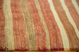 Handwoven texture with blush, ivory, and copper stripes on a vintage Turkish Kilim.