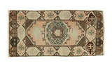 Vintage Oushak runner with an ornate geometric medallion in pastel earth tones, 1'7