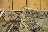 Hand-knotted Oushak runner border patterns in faded peach and seafoam green.