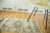 Vintage Oushak runner detail: faded ivory, sea foam green checkered corner and border.