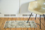 Faded central medallion, pastel earth tones, and geometric motifs on vintage Oushak runner.